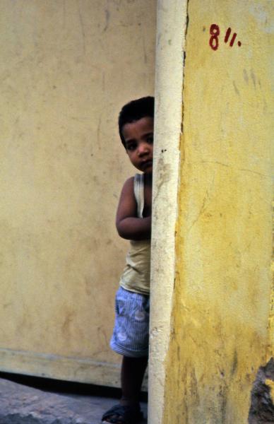 Child behind  a wall